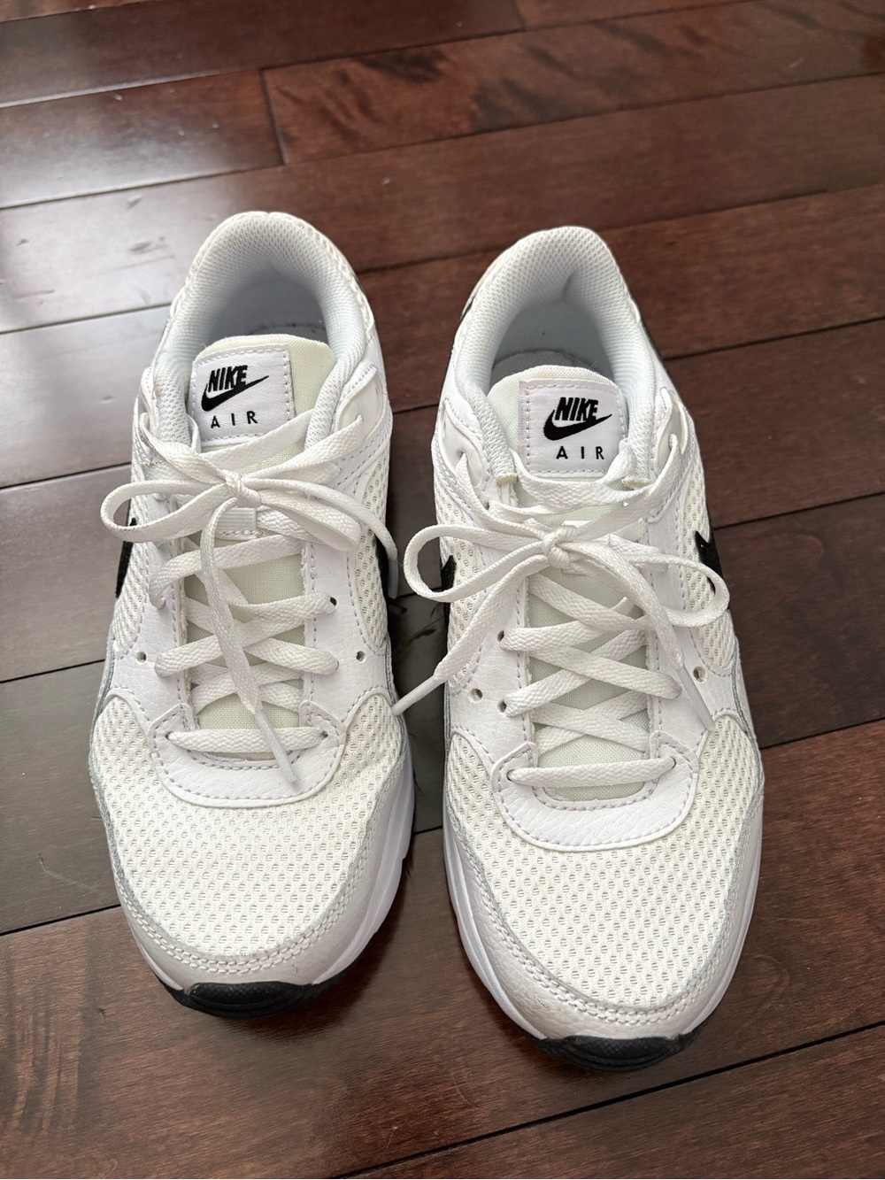 Nike White Mesh Sneakers with Black Swoosh